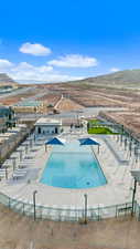 View of pool with a mountain view