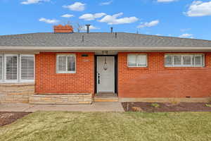 View of front of house with a front yard