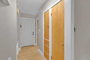 Corridor featuring hardwood flooring