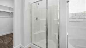 Bathroom with a shower with shower door