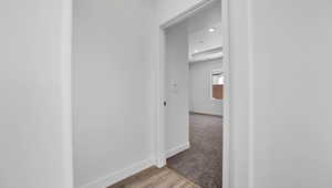 Hallway featuring light hardwood / wood-style floors