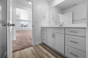 Bathroom featuring vanity and hardwood / wood-style flooring