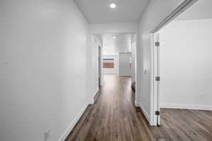 Hallway with wood-type flooring