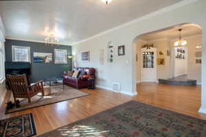 Living room featuring crown molding, and hardwood / wood-style flooring