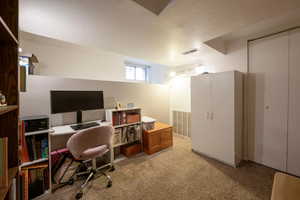 Bedroom with light carpet.