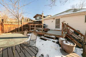 Winter View of snow covered deck and patio.