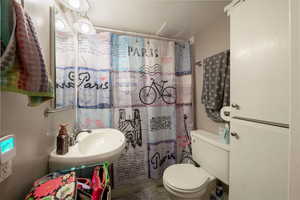 Basement bathroom with shower/bathtub combo.