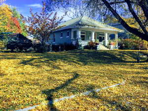 Fall view View of front of property, yard and  porch.