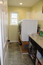 Washroom with washer and clothes dryer