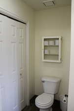 Bathroom suite featuring tile patterned floors and toilet