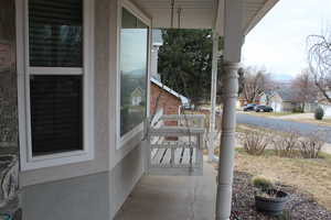 View of patio with a porch