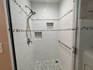 Primary bathroom with newly remodeled  shower with glass door