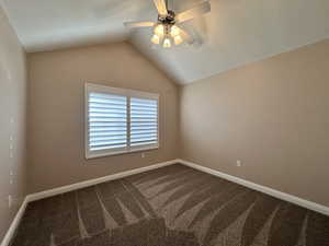 New flooring, featuring a lofted ceiling and plantation shutter