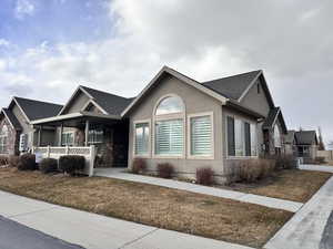 View of front of property with a front lawn and a porch