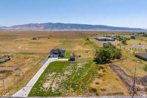 Drone / aerial view with a mountain view and a rural view