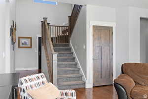 Stairway with hardwood / wood-style flooring