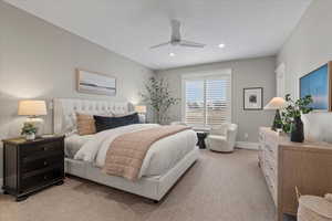 Carpeted bedroom with ceiling fan