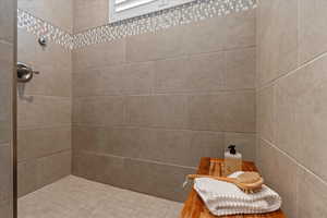 Bathroom with a tile shower