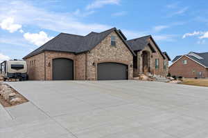 French provincial home featuring a garage