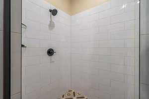 Bathroom featuring a tile shower