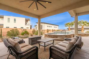 View of patio with outdoor lounge area and ceiling fan