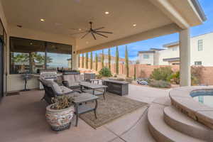 View of patio / terrace featuring ceiling fan, area for grilling, a grill, and an outdoor living space