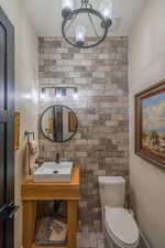 Bathroom featuring sink and toilet