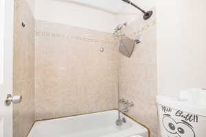 Bathroom featuring tiled shower / bath