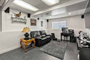 Living room featuring a paneled ceiling