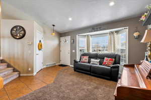 Tiled living room with a textured ceiling