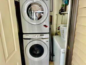 Laundry area featuring stacked washing maching and dryer