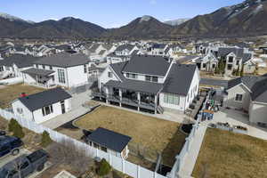 View of rear facade featuring a mountain view and a detached garage