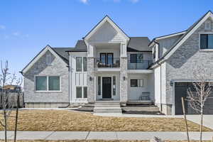 View of front facade featuring a mountain view and a detached garage