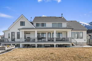 Back of the house with a mountain view