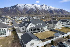 Back of home with mountain views