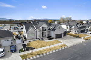 View of front facade featuring a mountain view and a detached garage