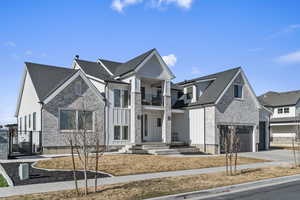 View of front facade featuring a mountain view and a detached garage