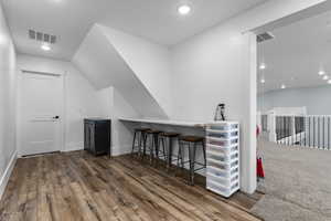 Upstairs hallway connecting 2 bedrooms and the shared bathroom