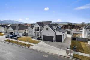 View of front facade featuring a mountain view and a detached garage