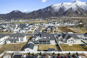 View of rear facade featuring a mountain view and a detached garage