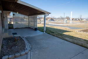 View of patio / terrace featuring a carport