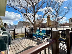 Wooden deck featuring a grill