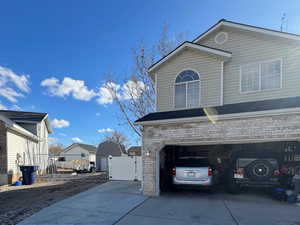 View of side of home featuring a garage