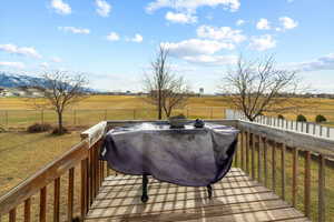 Wooden terrace featuring a rural view