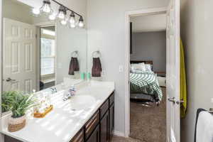 Bathroom with vanity and tile patterned floors