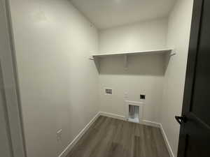 Washroom featuring washer hookup, dark hardwood / wood-style floors, and hookup for an electric dryer