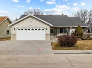 Ranch-style house featuring a garage