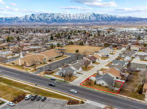 Birds eye view of property with a mountain view