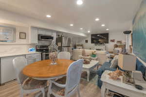 Dining space featuring laminate flooring