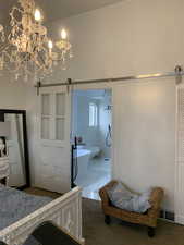 View of bathroom with sliding barn door.